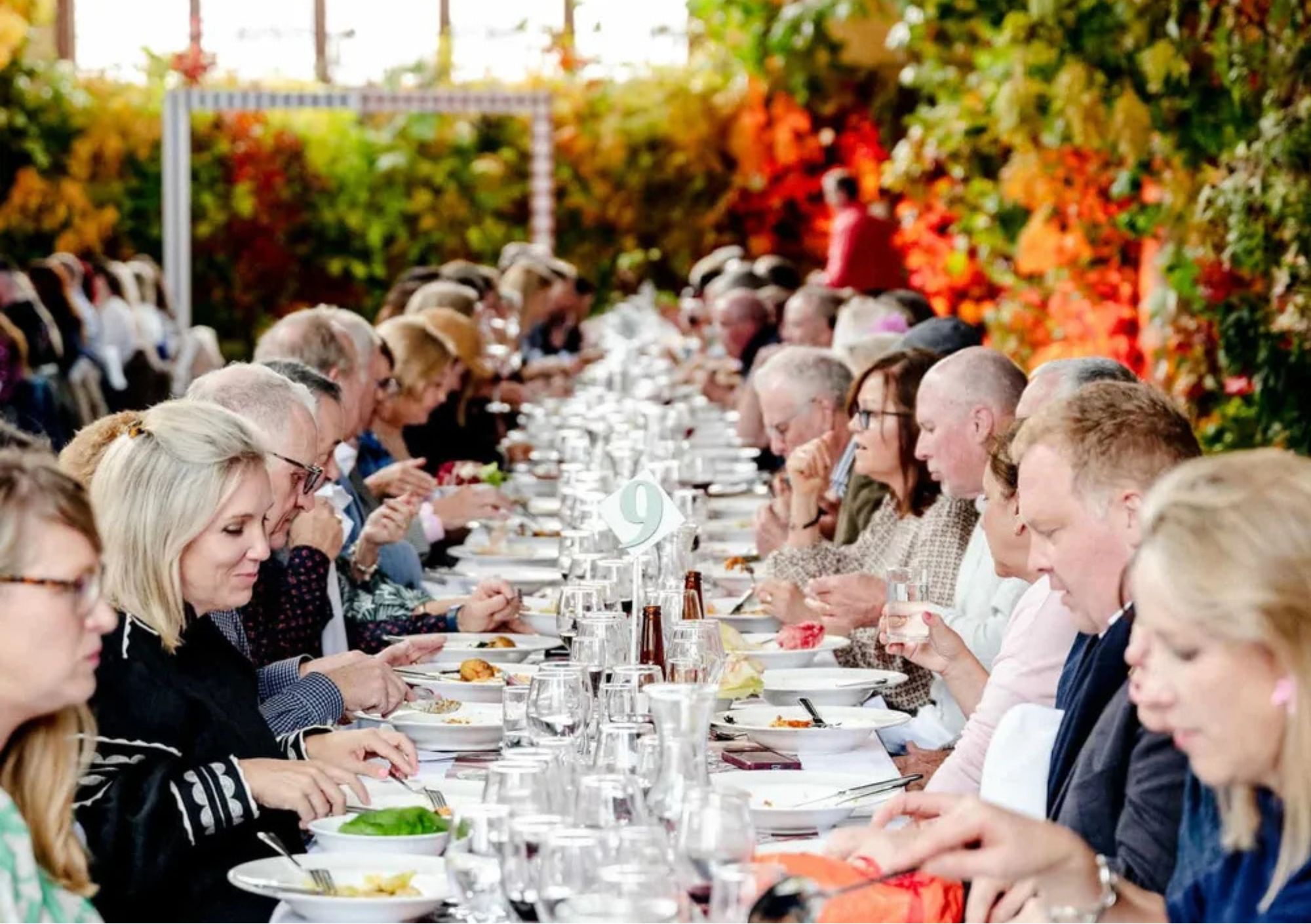 people enjoying an event at orange food week