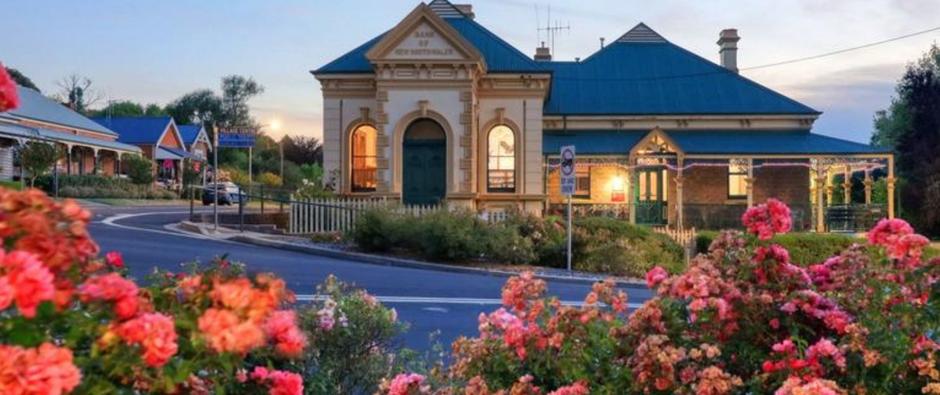 Historic streetscape and heritage building surrounded by flowers in Millthorpe NSW